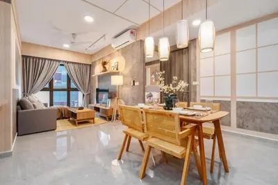 a dining room and living room with a table and chairs at Japandi 1BR Agile Bukit Bintang by RumaBnB in Kuala Lumpur