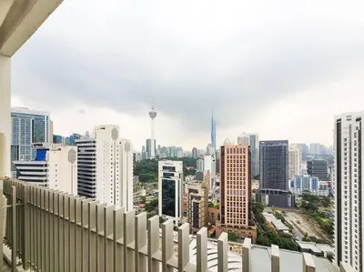 a view of a city skyline from a balcony at COL25A KL Tower Balcony 1Bedroom & Infinity Pool KLCC View in Kuala Lumpur