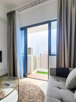 a living room with a couch and a large window at COL25A KL Tower Balcony 1Bedroom & Infinity Pool KLCC View in Kuala Lumpur