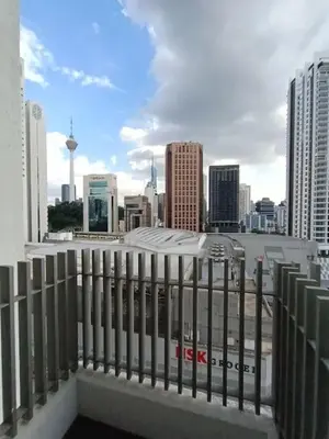 a view of a city skyline from a balcony at COL 25B KLCC Infinity Pool View Studio in Kuala Lumpur
