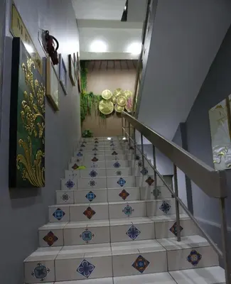 a staircase with blue and white tiles on the floor at Hotel La ISRA at Bukit Bintang in Kuala Lumpur
