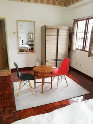 a living room with two chairs and a table at Kuala Lumpur Homestay Bandar Sri Permaisuri in Kuala Lumpur