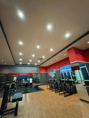 a gym with rows of chairs in a gym at Studio Stay in Kuala Lumpur
