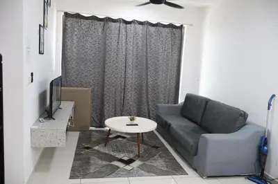 a living room with a couch and a table at Cozy kenwingston Platz KL 2-5 pax 2BR&2BR genting view parkin netflix 3802 in Kuala Lumpur