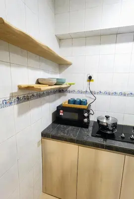 a kitchen with a counter with a pot on a stove at Tatami MUJI Relax 5p City center Staycation MRT in Kuala Lumpur