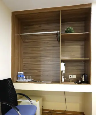 a room with a wooden wall with a window at ECO Hotel at BBCC in Kuala Lumpur