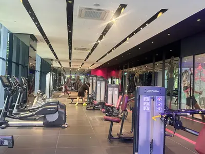 a gym with treadmills and machines in a building at STAR Residence KLCC City Centre in Kuala Lumpur