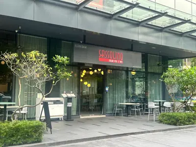 a restaurant with tables and chairs in a building at STAR Residence KLCC City Centre in Kuala Lumpur
