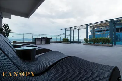 a balcony with benches and a view of a building at The Manor Signature Residence, Kuala Lumpur in Kuala Lumpur