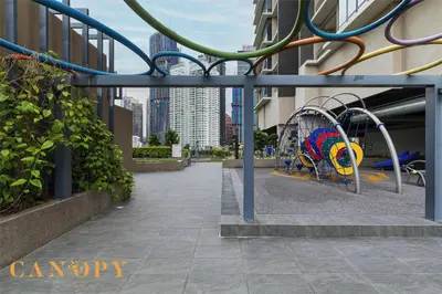 a playground with a slide in a city at The Manor Signature Residence, Kuala Lumpur in Kuala Lumpur