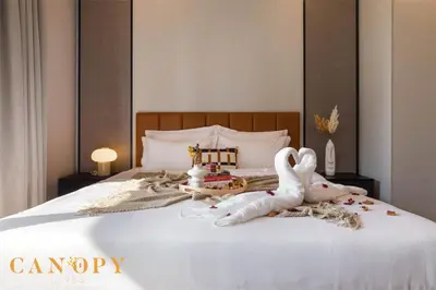 a bedroom with a bed with stuffed animals on it at The Manor Signature Residence, Kuala Lumpur in Kuala Lumpur