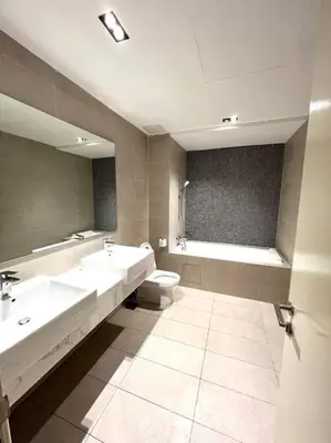 a bathroom with two sinks and a toilet and a tub at Ooak suites Mont Kiara 163 \uc624\ud06c\uc2a4\ud14c\uc774 in Kuala Lumpur