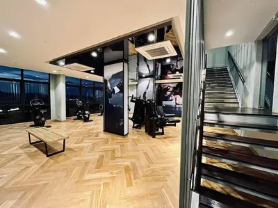 a large room with a staircase and a room with a stair case at The Ooak Kiara 163 in Kuala Lumpur