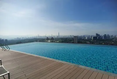 a swimming pool on the roof of a building at The Ooak Kiara 163 in Kuala Lumpur