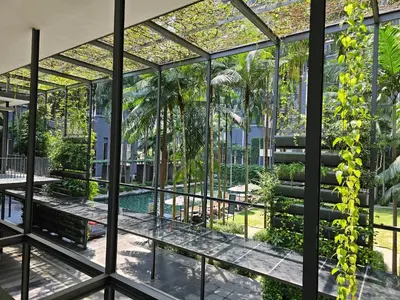 an internal view of a glass house with a pool at St Mary Pavilion KLCC 3BR6Pax in Kuala Lumpur