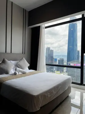 a bedroom with a bed and a large window at Cozy Axon Residence Bukit Bintang by Konoha Suites 1-6pax in Kuala Lumpur