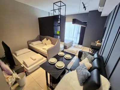 a living room with a couch and a table at Cozy Axon Residence Bukit Bintang by Konoha Suites 1-6pax in Kuala Lumpur