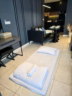 a white mattress on the floor in a room with a piano at Cozy Axon Residence Bukit Bintang by Konoha Suites 1-6pax in Kuala Lumpur