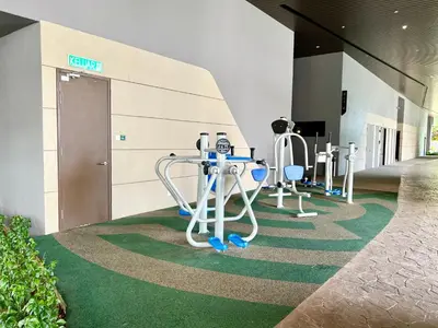 a hallway with a table and chairs in a building at Cozy Axon Residence Bukit Bintang by Konoha Suites 1-6pax in Kuala Lumpur