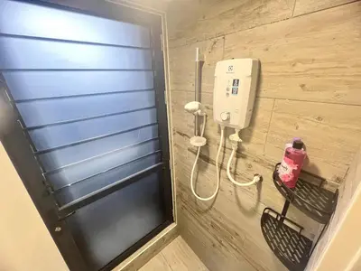a bathroom with a phone on the wall at Simple Arte Mont Kiara 2 , MITEC Matrade Publika in Kuala Lumpur