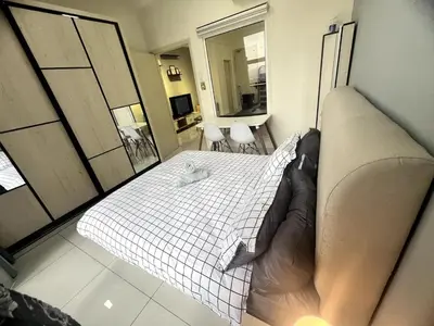a bedroom with a bed in a room at Simple Arte Mont Kiara 2 , MITEC Matrade Publika in Kuala Lumpur