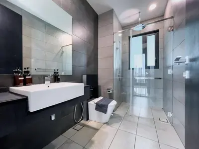 a bathroom with a sink and a toilet at Opus Residences by Wakely Kuala Lumpur in Kuala Lumpur