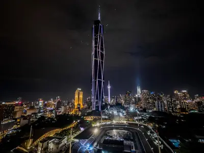 a view of a city at night at Opus Residences by Wakely Kuala Lumpur in Kuala Lumpur