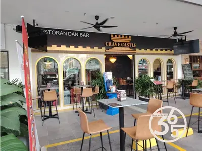a restaurant with chairs and tables in front of it at Trion Kuala Lumpur Superior room nearby mrt in Kuala Lumpur