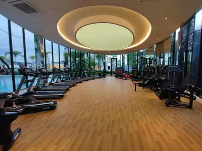a gym with rows of treadmills and a large chandelier at Trion Kuala Lumpur Superior room nearby mrt in Kuala Lumpur