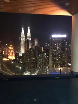 a view of a city skyline at night at CityStay at Luxe Colony KLCC in Kuala Lumpur