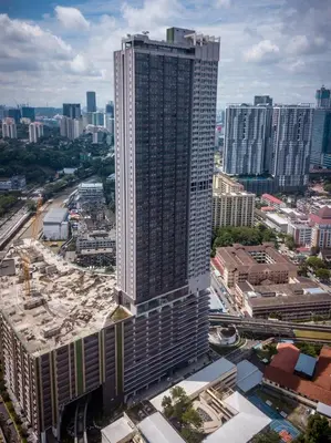 an overhead view of a tall building in a city at Upper Hotel Suites KL Sentral in Kuala Lumpur