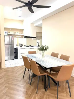 a dining room table with chairs and a ceiling fan at Best Spot in City in Kuala Lumpur
