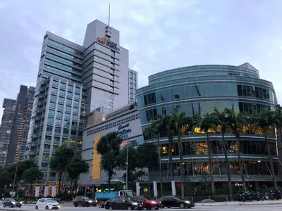 a group of tall buildings in a city with cars at Cozy Downtown 2BR at M Suites, Embassy Row in Kuala Lumpur