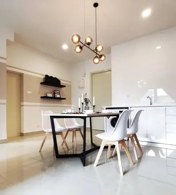 a kitchen with a dining table and white chairs at Arte Plus Jalan Ampang, KLCC Level 35 in Kuala Lumpur