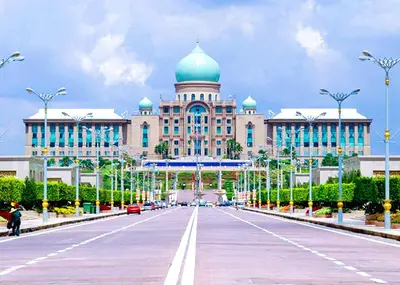 a large building with a blue dome on a street at ARK Wave Hotel Ampang in Ampang