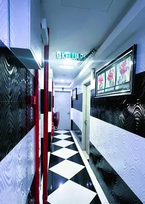 a train hallway with a black and white checkered floor at ARK Wave Hotel Ampang in Ampang