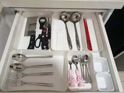 a white tray with utensils in a drawer at Arte Mont Kiara Studio,Kuala Lumpur in Kuala Lumpur