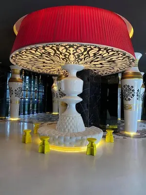 a vase with a red top on a table at Arte Mont Kiara Studio,Kuala Lumpur in Kuala Lumpur