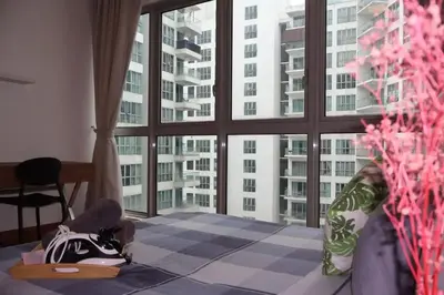 a room with a large window in a building at Nice stay by regalia in Kuala Lumpur
