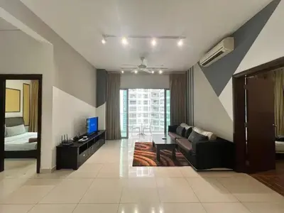 a living room with a couch and a television at Nice stay by regalia in Kuala Lumpur