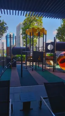 a playground with a slide and a slide at 2-Bedroom Apartment in Kuala Lumpur City Center in Kuala Lumpur