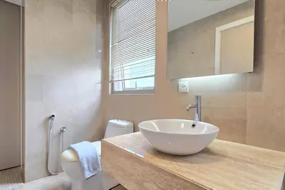 a bathroom with a bowl sink and a toilet at Bukit Bintang Fairlane 1412 for 1-5pax 1BR TRX Pavilion KL in Kuala Lumpur