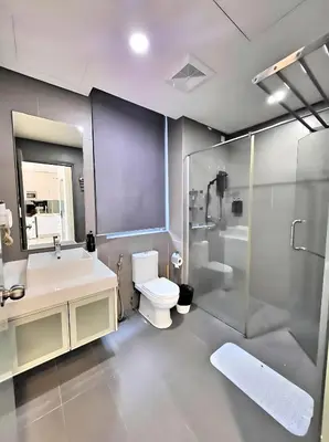 a bathroom with a toilet and a shower and a sink at Prime Summer Suites KLCC in Kuala Lumpur
