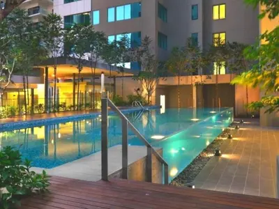 a swimming pool in front of a building at Prime Summer Suites KLCC in Kuala Lumpur