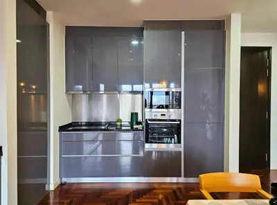 a kitchen with stainless steel cabinets and a microwave at The Mews Kuala Lumpur Homestay with Bathtub 700m to KLCC by Cloud Host in Kuala Lumpur