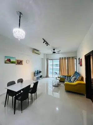 a living room with a table and a yellow couch at Regalia Residence By Willow Home in Kuala Lumpur
