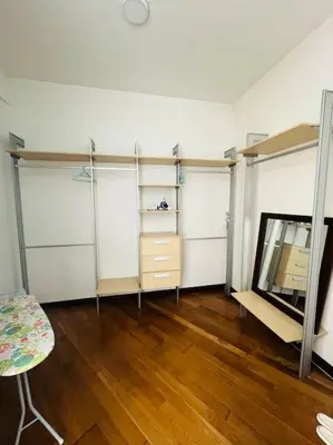 a room with shelves and a mirror and a table at Regalia Residence By Willow Home in Kuala Lumpur