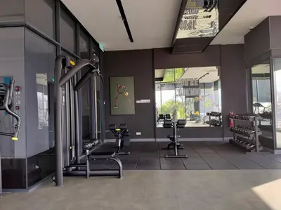 a gym with several exercise equipment in a building at Continew TRX Corner 2-BR, 2 Balconies City Views in Kuala Lumpur