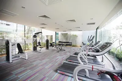 a gym with treadmills and elliptical machines at Twin Towers Suites - 7mins walking to KLCC in Kuala Lumpur