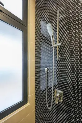 a shower in a bathroom with a window at Continew TRX Corner Dual Balconies 2 Bedrooms in Kuala Lumpur